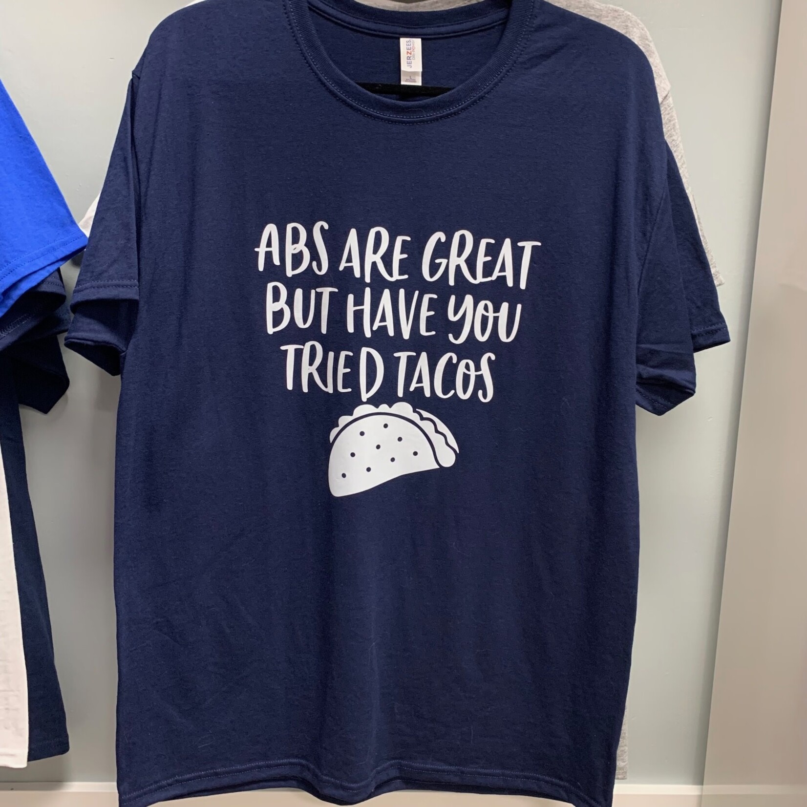 https://cdn.shoplightspeed.com/shops/660096/files/56311181/1652x1652x1/abs-are-great-but-have-you-tried-tacos-shirt.jpg