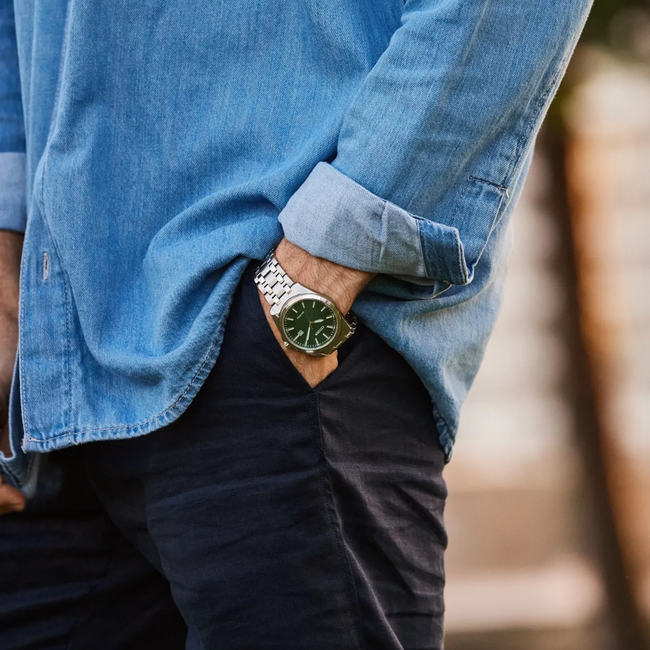 Make a distinctive style statement. Featuring a gold-tone stainless steel case steel case and a champagne 3-hand dial encased in sapphire crystal, this timepiece is a combination of functional simplicity with a touch of elegance.