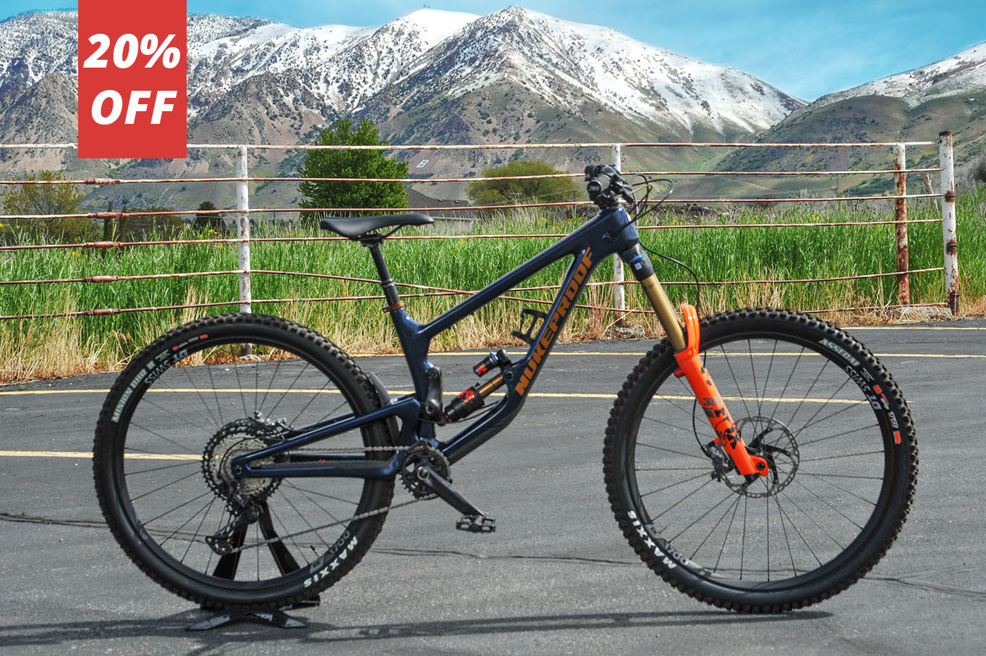 Image of a Nukeproof Giga mountain bike in front of a mountain