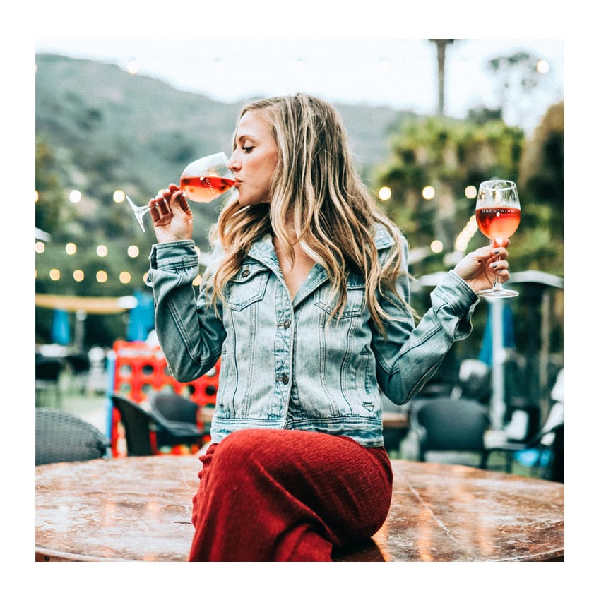 woman drinking wine, quality wine shop