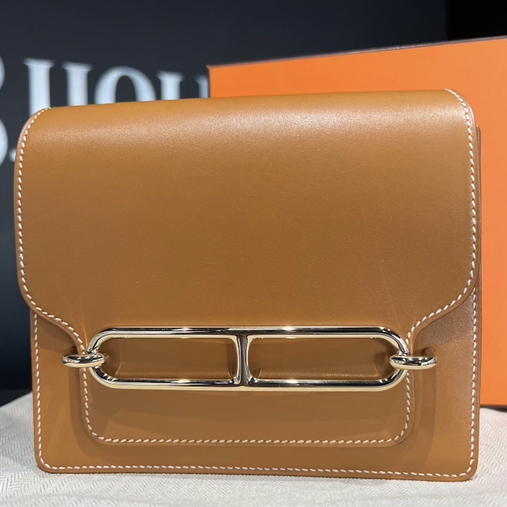 Hermes SOLD - Hermes Roulis Mini Gold In Swift Leather GHW