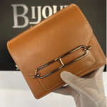 Hermes SOLD - Hermes Roulis Mini Gold In Swift Leather GHW