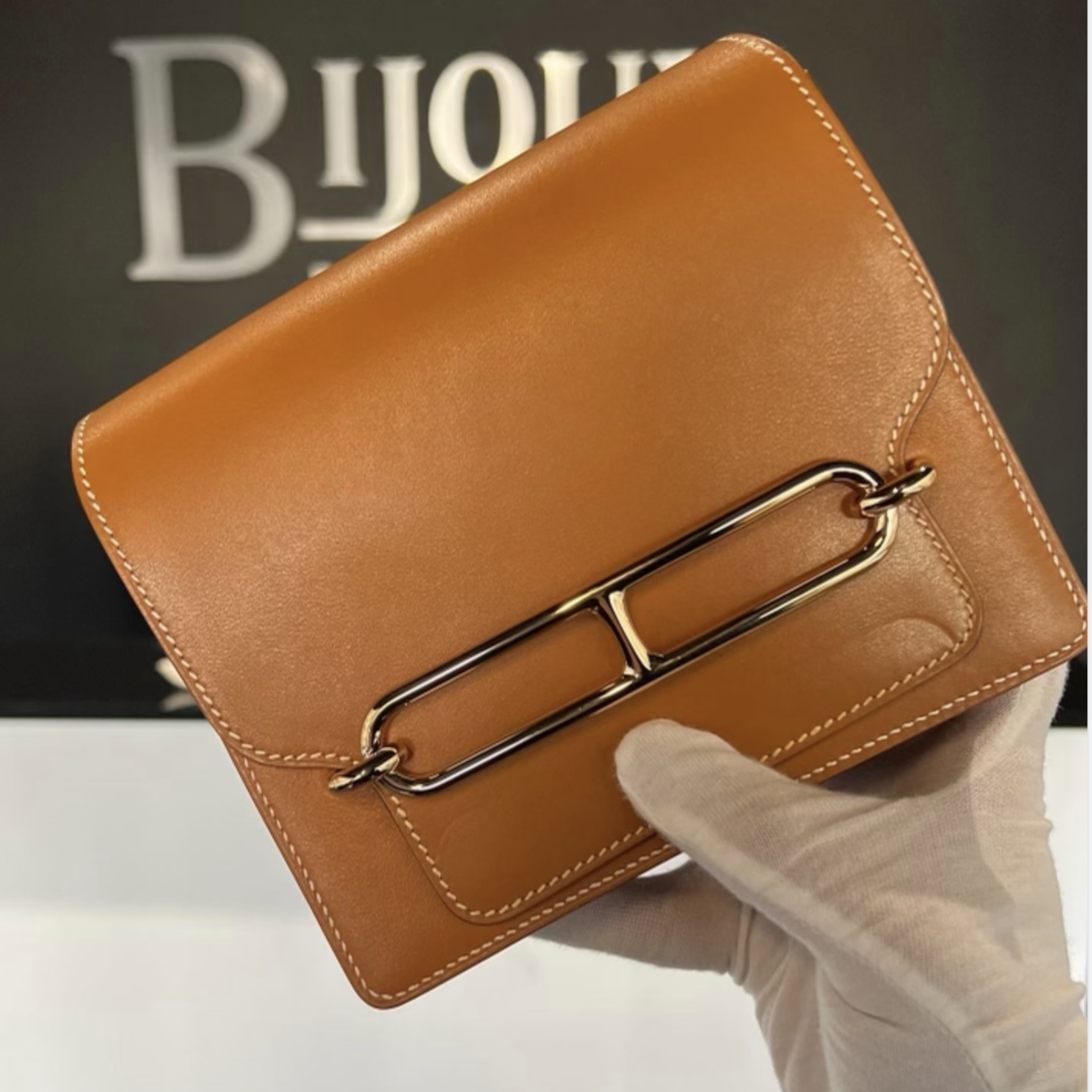 Hermes SOLD - Hermes Roulis Mini Gold In Swift Leather GHW