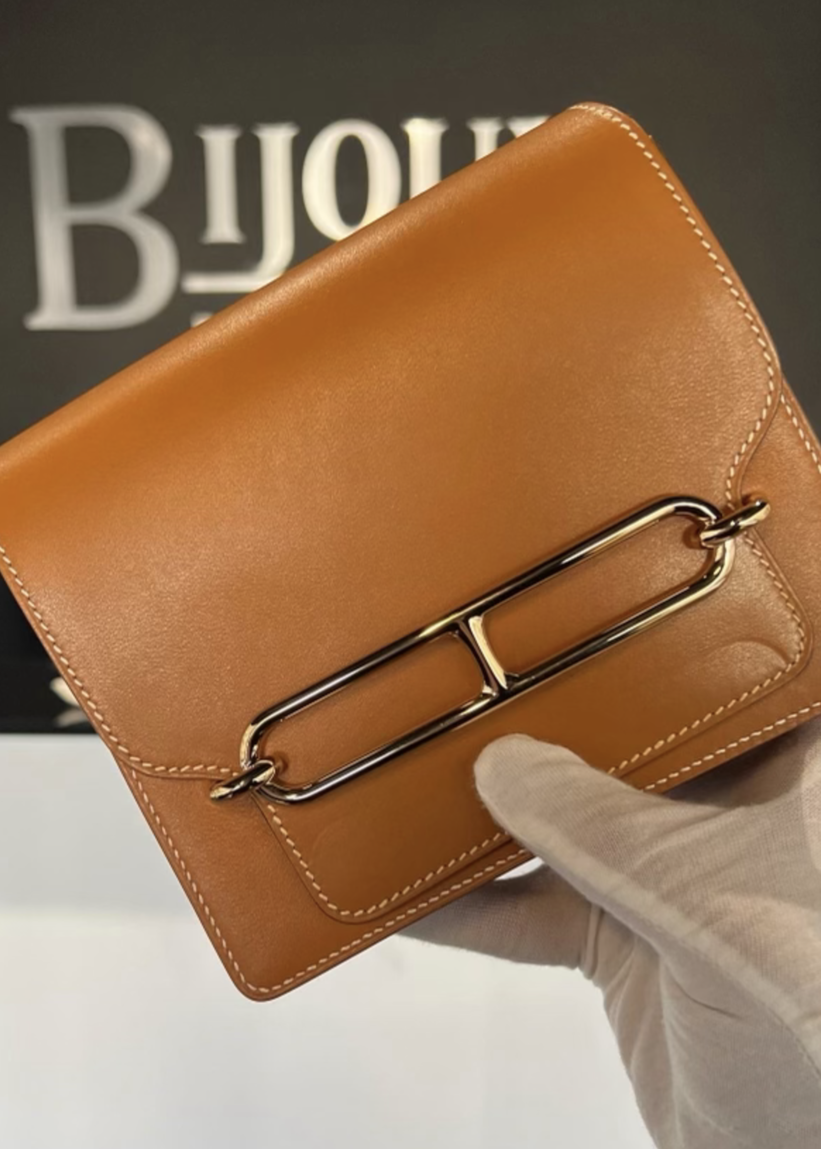 Hermes SOLD - Hermes Roulis Mini Gold In Swift Leather GHW