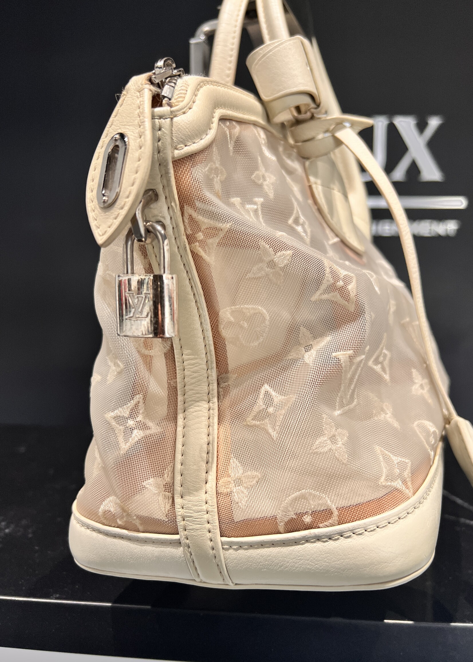 Louis Vuitton SOLD - Louis Vuitton Transparence Lock It