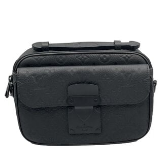 Louis Vuitton Louis Vuitton taurillon monogram s lock messenger bag black (pre owned)