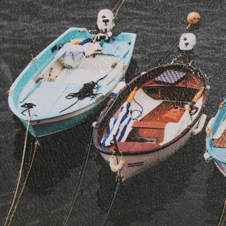 NEATLY MOORED GLASS FRAMED PRINT