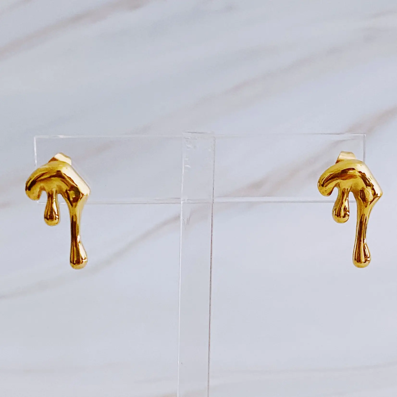 Draping gold molten stud earrings