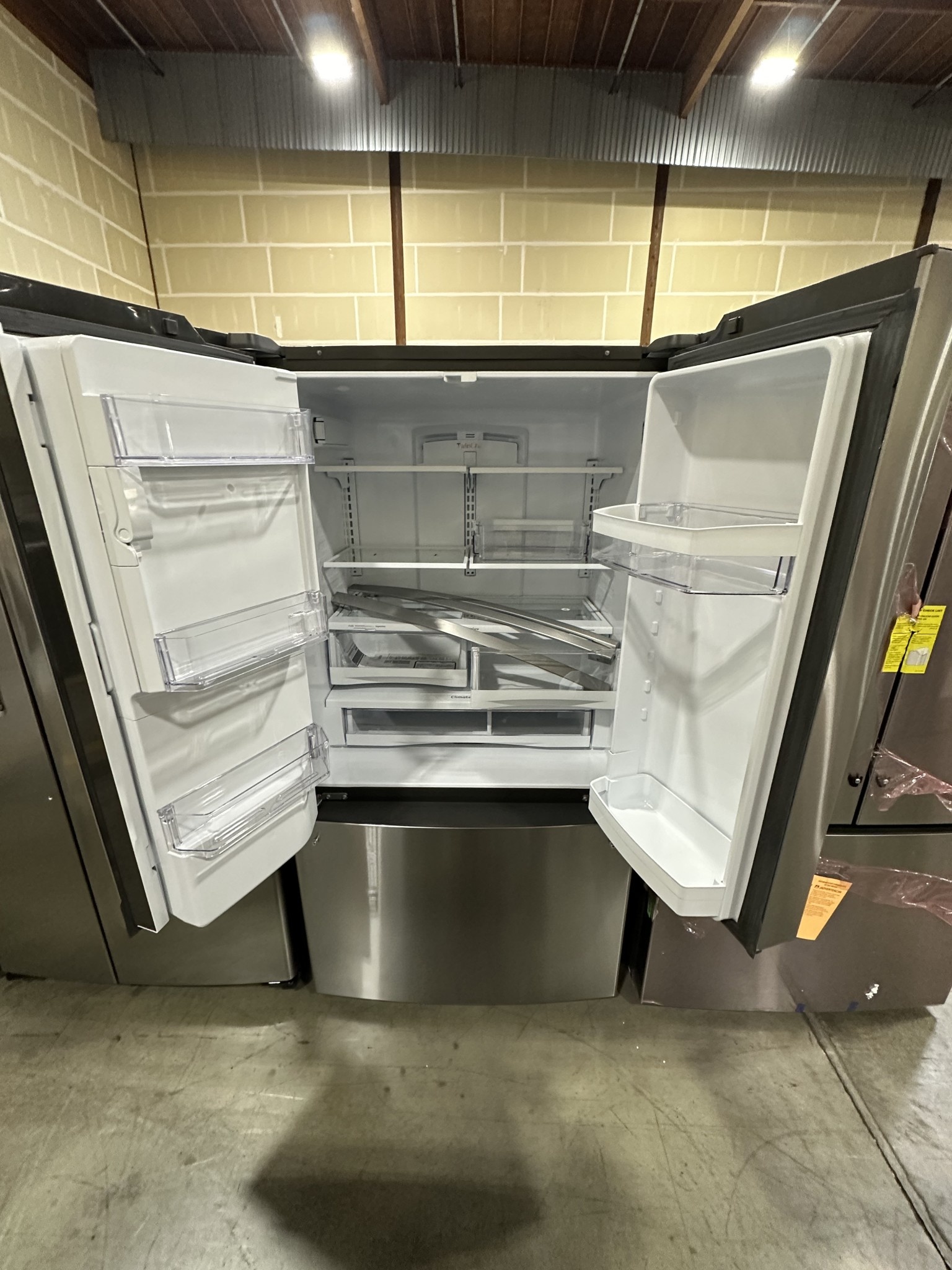 GE GE GYE22GYNFS 22.1 cu. ft. French Door Refrigerator in Fingerprint
