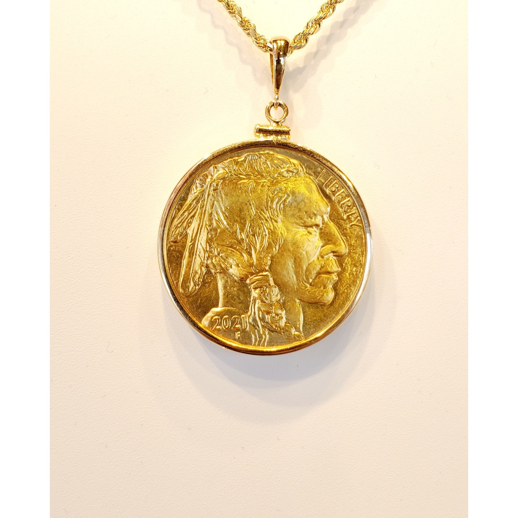 1 oz. $50 Gold Buffalo .9999 fine in 14KY Bezel