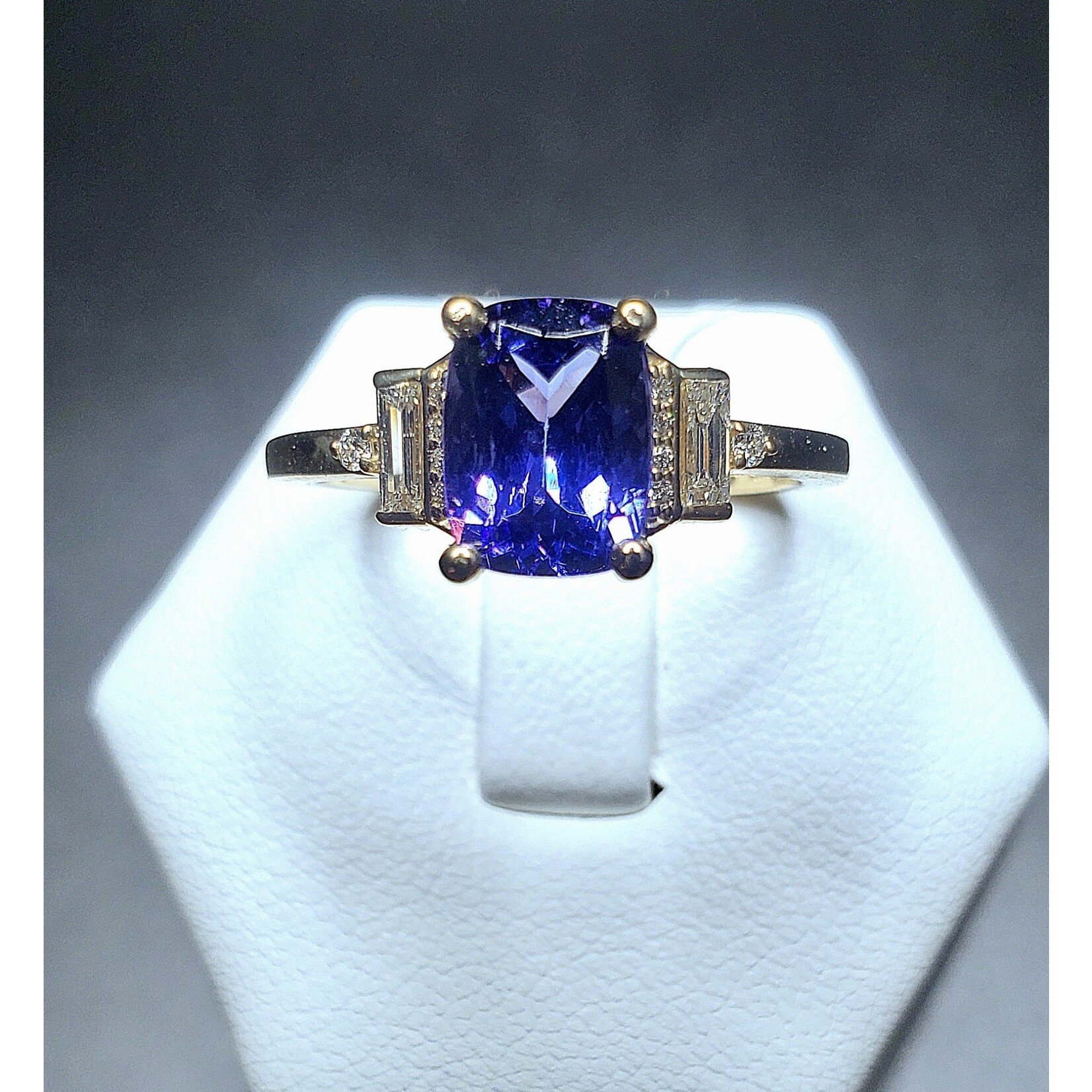 14 Karat Yellow Gold 1.49 Carat Natural Tanzanite w/ 1/6 Carat Total Weight Diamond Baguettes and Rounds Accents