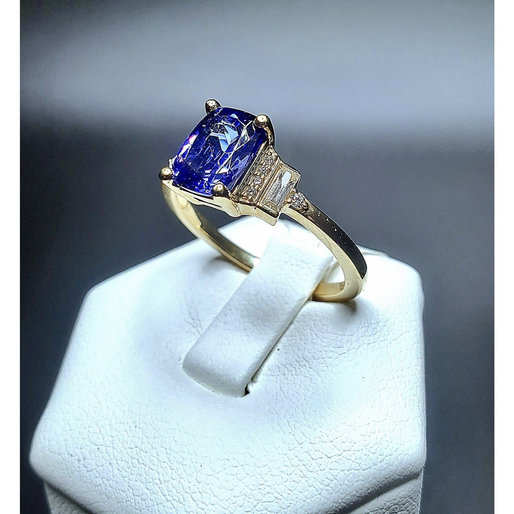 14 Karat Yellow Gold 1.49 Carat Natural Tanzanite w/ 1/6 Carat Total Weight Diamond Baguettes and Rounds Accents