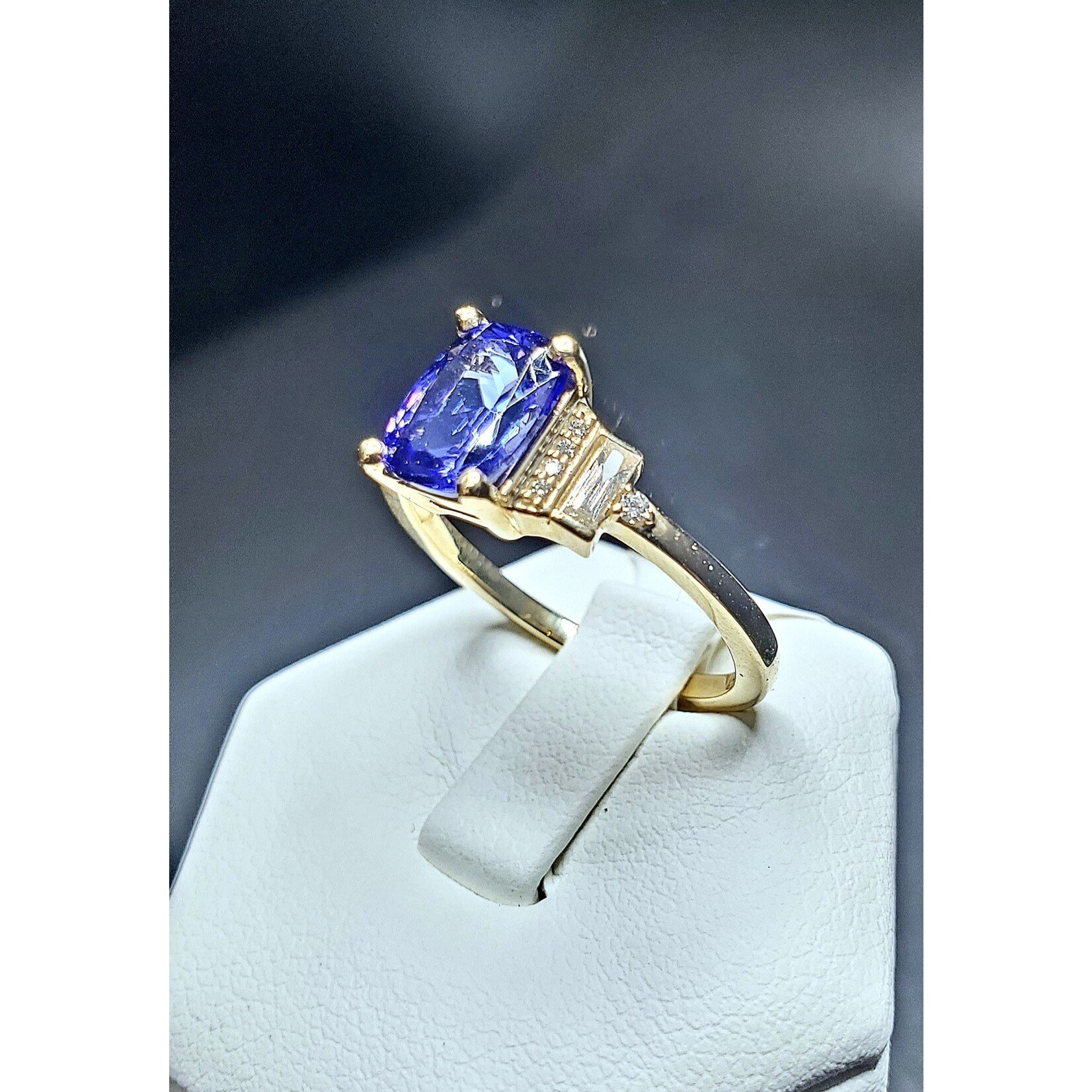 14 Karat Yellow Gold 1.49 Carat Natural Tanzanite w/ 1/6 Carat Total Weight Diamond Baguettes and Rounds Accents