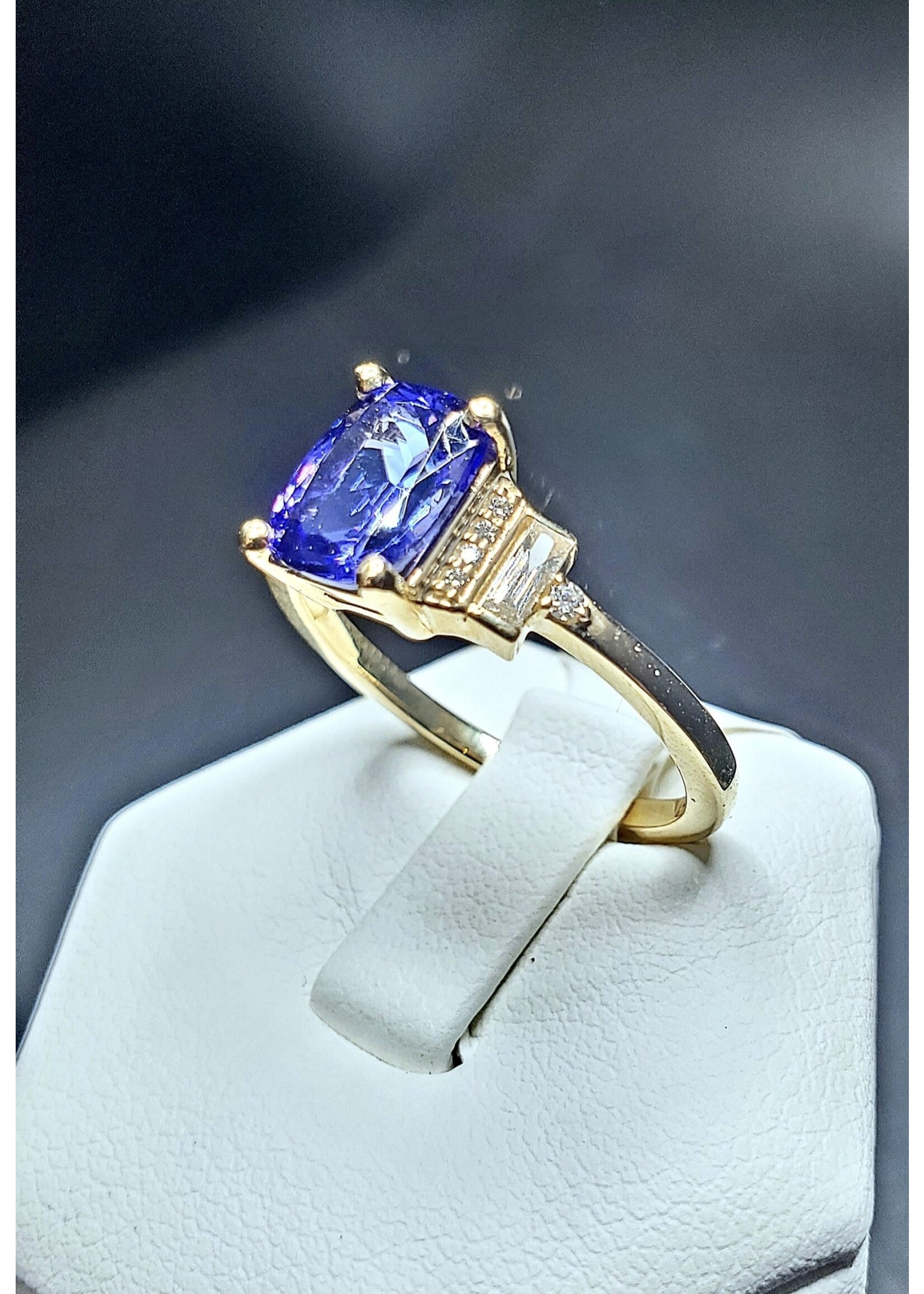 14 Karat Yellow Gold 1.49 Carat Natural Tanzanite w/ 1/6 Carat Total Weight Diamond Baguettes and Rounds Accents