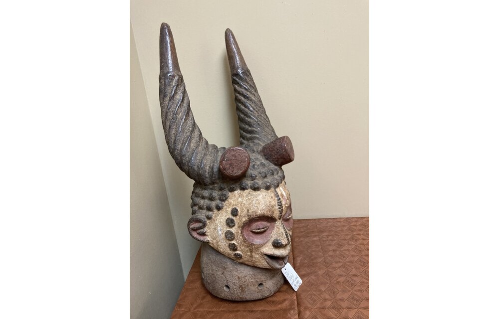 Ibo (igbo) headpiece/mask of wood, kaolin of red pigment that had use in the powerful men's secret society called mmo or mwo or mwa. It is 20 1/2" tall and 9/14" w. The Ibo live in the South east of N