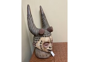 Ibo (igbo) headpiece/mask of wood, kaolin of red pigment that had use in the powerful men's secret society called mmo or mwo or mwa. It is 20 1/2" tall and 9/14" w. The Ibo live in the South east of N