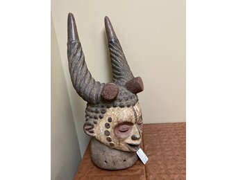 Ibo (igbo) headpiece/mask of wood, kaolin of red pigment that had use in the powerful men's secret society called mmo or mwo or mwa. It is 20 1/2" tall and 9/14" w. The Ibo live in the South east of N