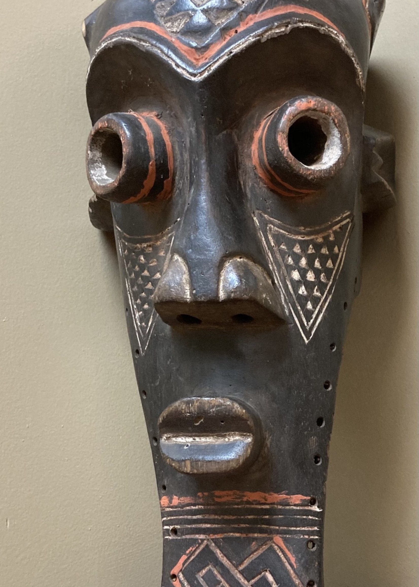 Kuba Kete of the Kuba confederation: initiation mask wooden with kaolin white and tukala red pigment. 20 1/4" tall x 9" wide (ear to ear). Dem Rep of Congo