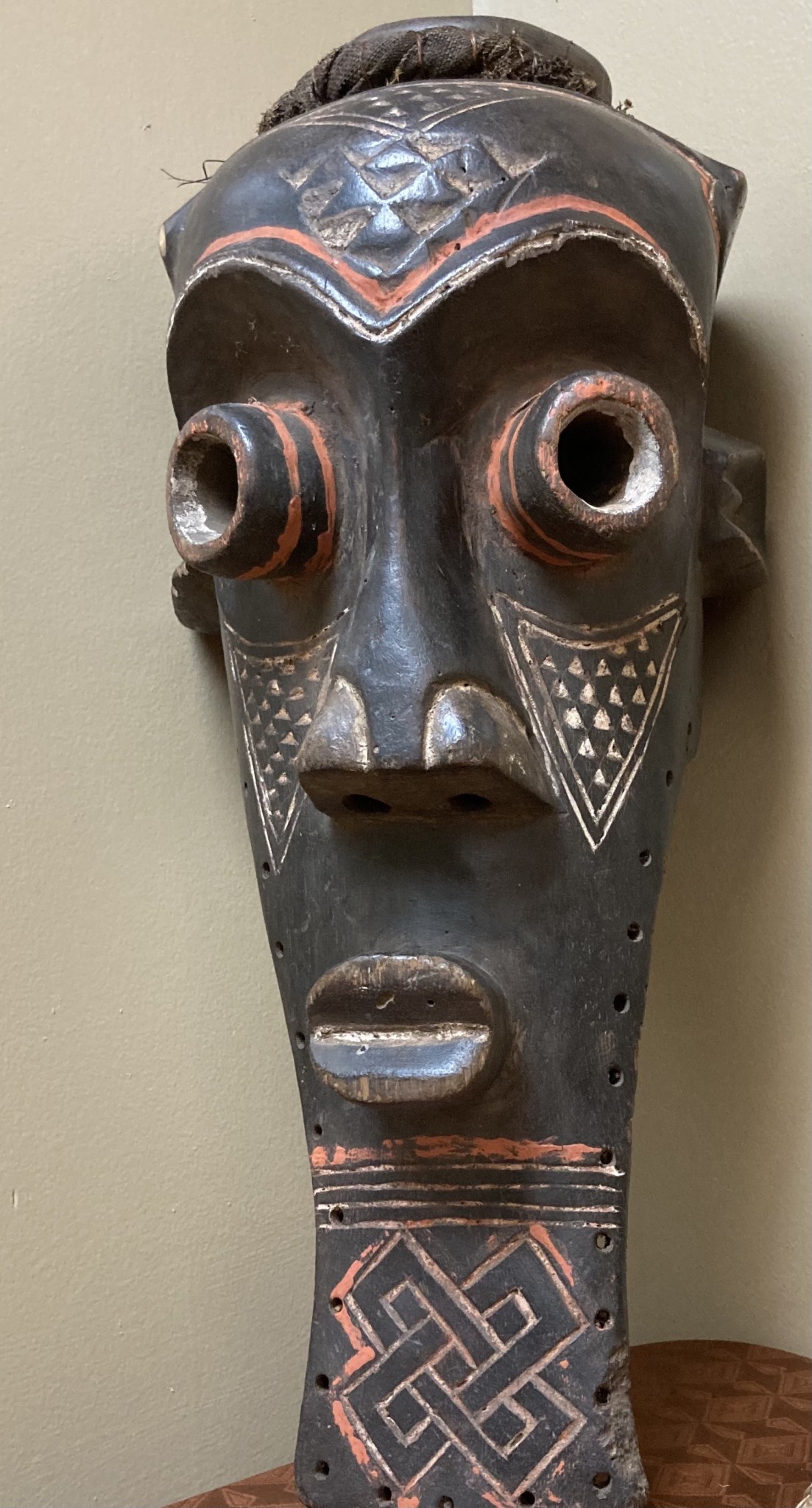 Kete of the Kuba confederation: initiation mask wooden with kaolin white and tukala red pigment. 20 1/4" tall x 9" wide (ear to ear). Dem Rep of Congo