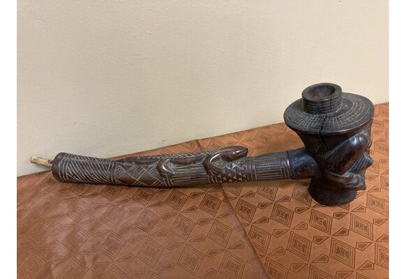 Kuba (bakuba): Wooden pipe, probably made by the Denguese who did much wood carvings as one of the 18 kuba tribes in the Democratic Republic of Congo. 16 1/4" L x 5 1/4" tall