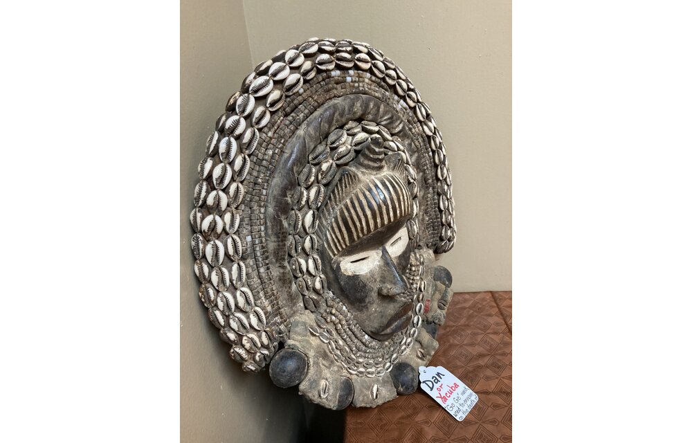 Dan (Yacuba) "Go Ge" mask: The job of this mask is to announce the death of the chief. The dan are found in SW ivory coast and next door in Liberia. Wood, cowrie shells, fabric, and kaolin (white colo
