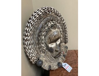 Dan (Yacuba) "Go Ge" mask: The job of this mask is to announce the death of the chief. The dan are found in SW ivory coast and next door in Liberia. Wood, cowrie shells, fabric, and kaolin (white colo
