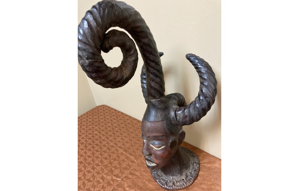 Ekoi (Ejagham): Ekoi wooden masks are covered with animal skin. These figures usually refer to cultural or war heroes. This piece was worn on the top of a woman's head. 20 1/4" tall x 11 1/4" W. Niger