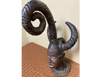 Ekoi (Ejagham): Ekoi wooden masks are covered with animal skin. These figures usually refer to cultural or war heroes. This piece was worn on the top of a woman's head. 20 1/4" tall x 11 1/4" W. Niger