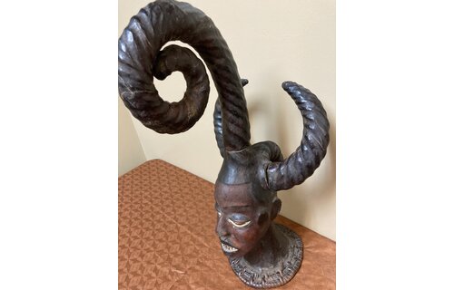 Ekoi (Ejagham): Ekoi wooden masks are covered with animal skin. These figures usually refer to cultural or war heroes. This piece was worn on the top of a woman's head. 20 1/4" tall x 11 1/4" W. Niger