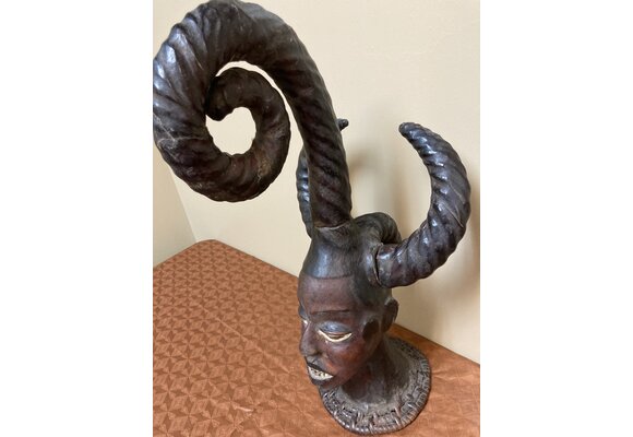 Ekoi (Ejagham): Ekoi wooden masks are covered with animal skin. These figures usually refer to cultural or war heroes. This piece was worn on the top of a woman's head. 20 1/4" tall x 11 1/4" W. Niger