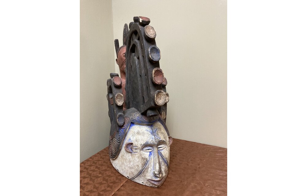 Ibo (Igbo) “Spirit Maiden” mask representing a beautiful young maiden. These masks are danced by men. The Ibo live in the south east of nigeria. 22" tall x 17 1/2" deep x 7" w. $435