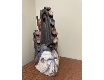 Ibo (Igbo) “Spirit Maiden” mask representing a beautiful young maiden. These masks are danced by men. The Ibo live in the south east of nigeria. 22" tall x 17 1/2" deep x 7" w. $435