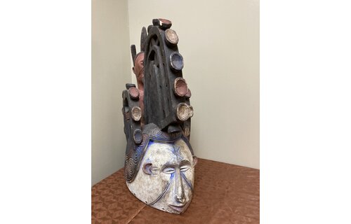 Ibo (Igbo) “Spirit Maiden” mask representing a beautiful young maiden. These masks are danced by men. The Ibo live in the south east of nigeria. 22" tall x 17 1/2" deep x 7" w. $435