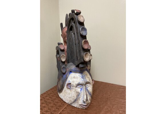 Ibo (Igbo) “Spirit Maiden” mask representing a beautiful young maiden. These masks are danced by men. The Ibo live in the south east of nigeria. 22" tall x 17 1/2" deep x 7" w. $435