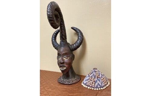 Ekoi (Ejagham): Ekoi wooden masks are covered with animal skin. These figures usually refer to cultural or war heroes. This piece was worn on the top of a woman's head. 20 1/4" tall x 11 1/4" W. Niger