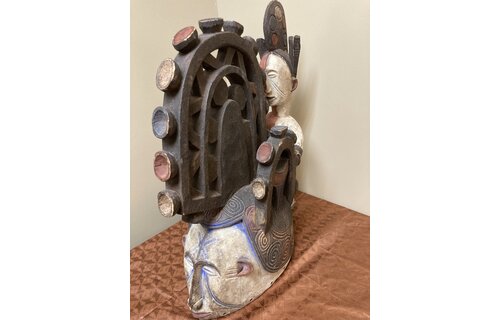 Ibo (Igbo) “Spirit Maiden” mask representing a beautiful young maiden. These masks are danced by men. The Ibo live in the south east of nigeria. 22" tall x 17 1/2" deep x 7" w. $435