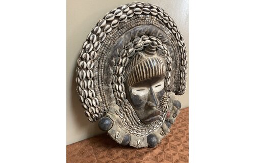 Dan (Yacuba) "Go Ge" mask: The job of this mask is to announce the death of the chief. The dan are found in SW ivory coast and next door in Liberia. Wood, cowrie shells, fabric, and kaolin (white colo