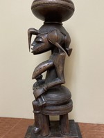Senufo Senufo maternity figure: She references the "Calao" (the hornbill bird), the bird is revered for it's devoted parenting. Wood. 19 1/2 tall" 7 1/4" deep. North central Ivory Coast or Cote D'ivoire