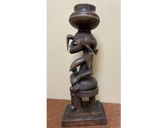 Senufo maternity figure: She references the "Calao" (the hornbill bird), the bird is revered for it's devoted parenting. Wood. 19 1/2 tall" 7 1/4" deep. North central Ivory Coast or Cote D'ivoire