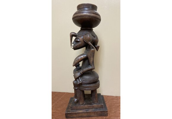 Senufo maternity figure: She references the "Calao" (the hornbill bird), the bird is revered for it's devoted parenting. Wood. 19 1/2 tall" 7 1/4" deep. North central Ivory Coast or Cote D'ivoire