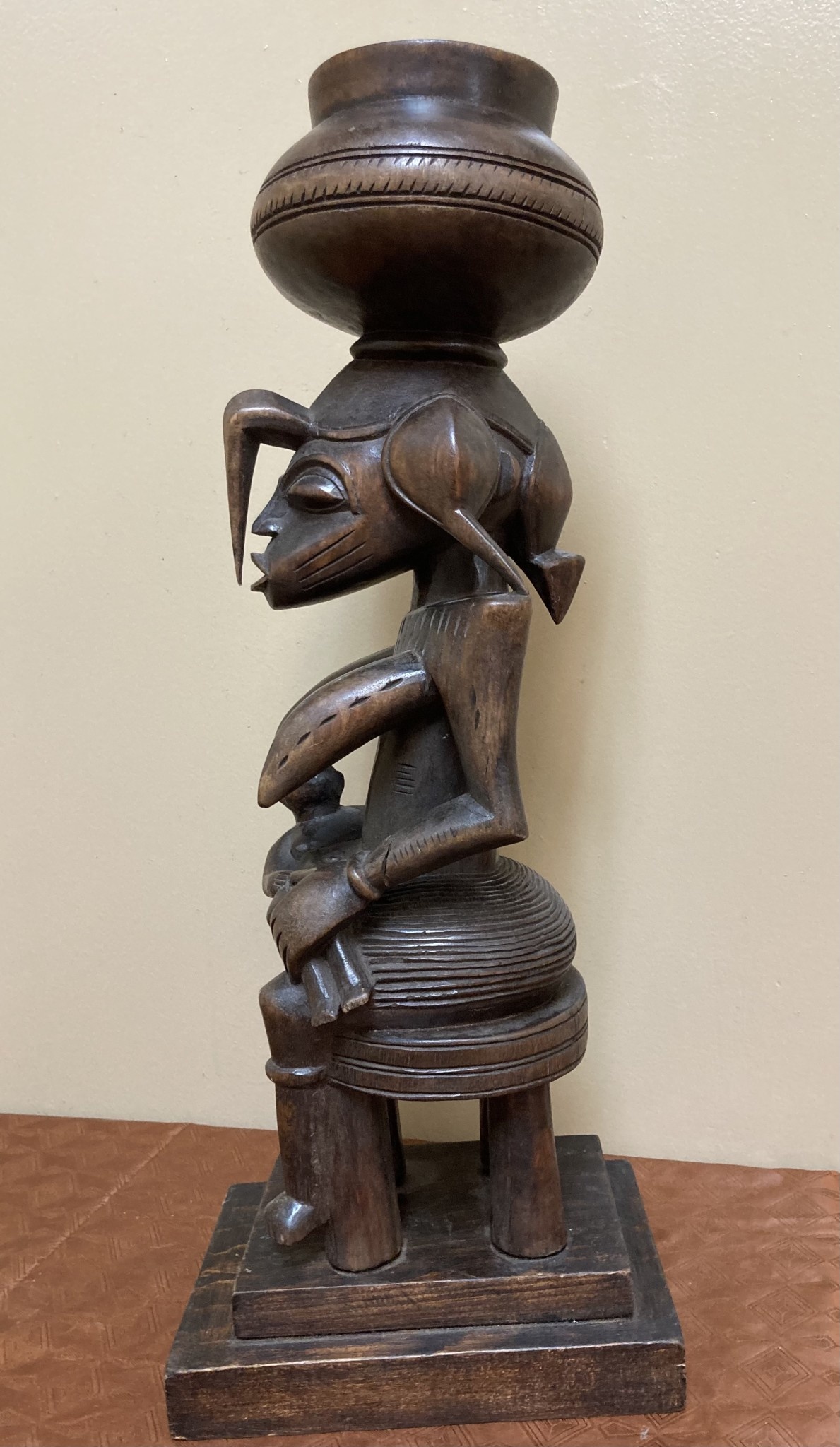 Senufo maternity figure: She references the "Calao" (the hornbill bird), the bird is revered for it's devoted parenting. Wood. 19 1/2 tall" 7 1/4" deep. North central Ivory Coast or Cote D'ivoire