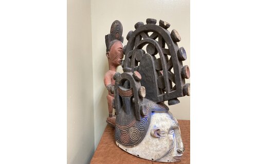 Ibo (Igbo) “Spirit Maiden” mask representing a beautiful young maiden. These masks are danced by men. The Ibo live in the south east of nigeria. 22" tall x 17 1/2" deep x 7" w. $435