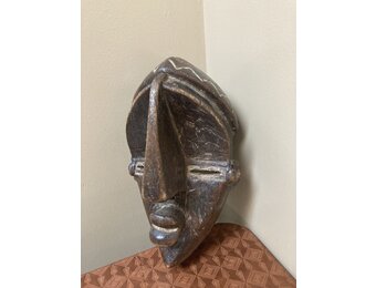 Lwalwa “Mfondo” mask: Worn at initiations and to bring good fortune to the village. The Lwala are related to the Bena Lulua, and reside near Dem Rep of Congo’s border with Angola. 11 ⅞” tall