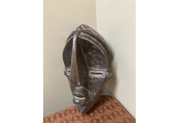 Lwalwa “Mfondo” mask: Worn at initiations and to bring good fortune to the village. The Lwala are related to the Bena Lulua, and reside near Dem Rep of Congo’s border with Angola. 11 ⅞” tall