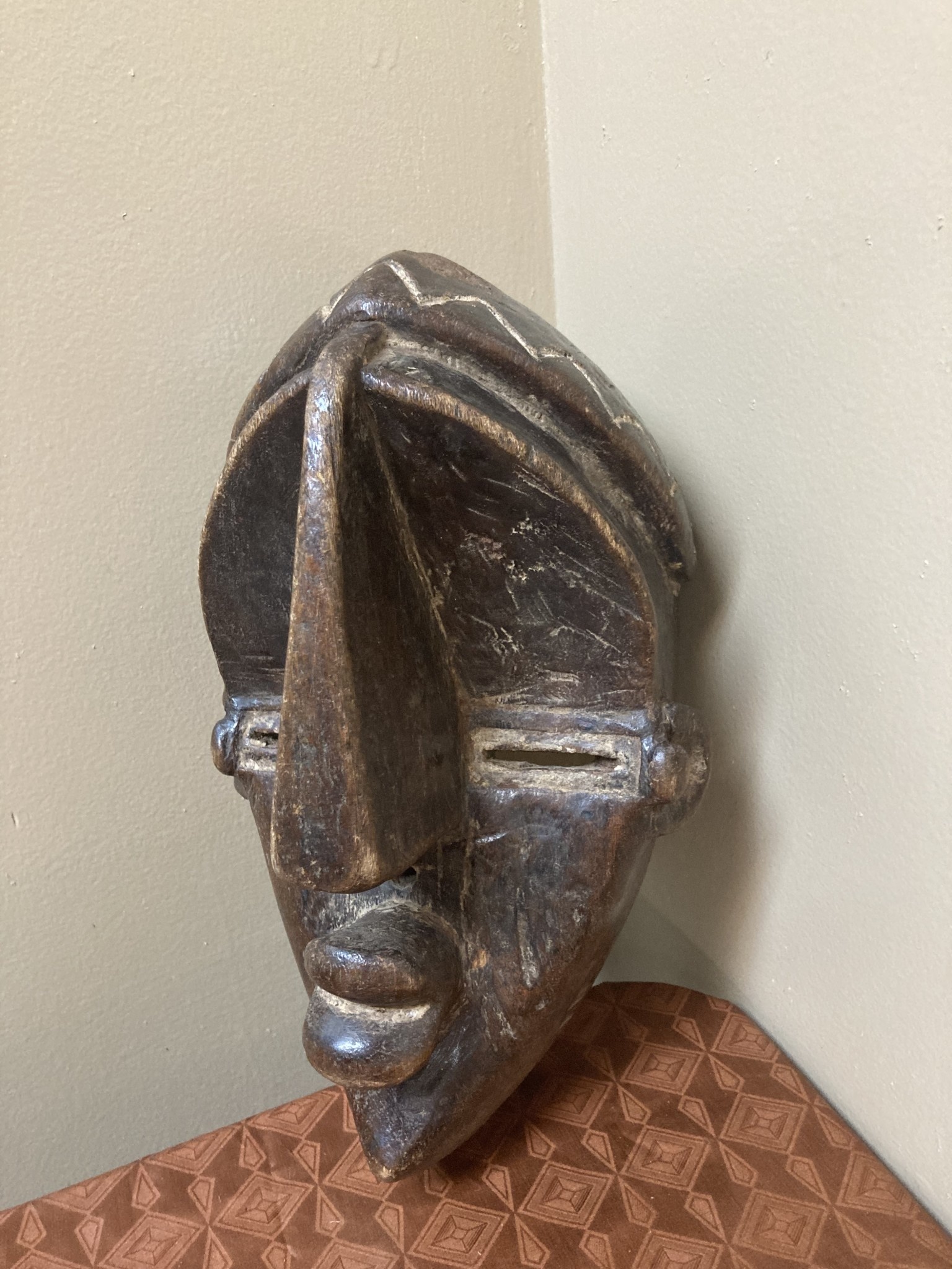Lwalwa “Mfondo” mask: Worn at initiations and to bring good fortune to the village. The Lwala are related to the Bena Lulua, and reside near Dem Rep of Congo’s border with Angola. 11 ⅞” tall