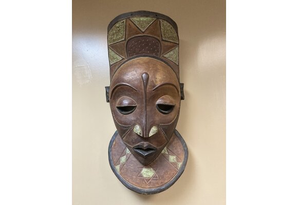 Pende X-Large Mask: The Bapende are found in Dem Rep of Congo. This mask is 35 ½” tall and 16 ½” wide. Masks this size often decorated a meeting house. Wooden