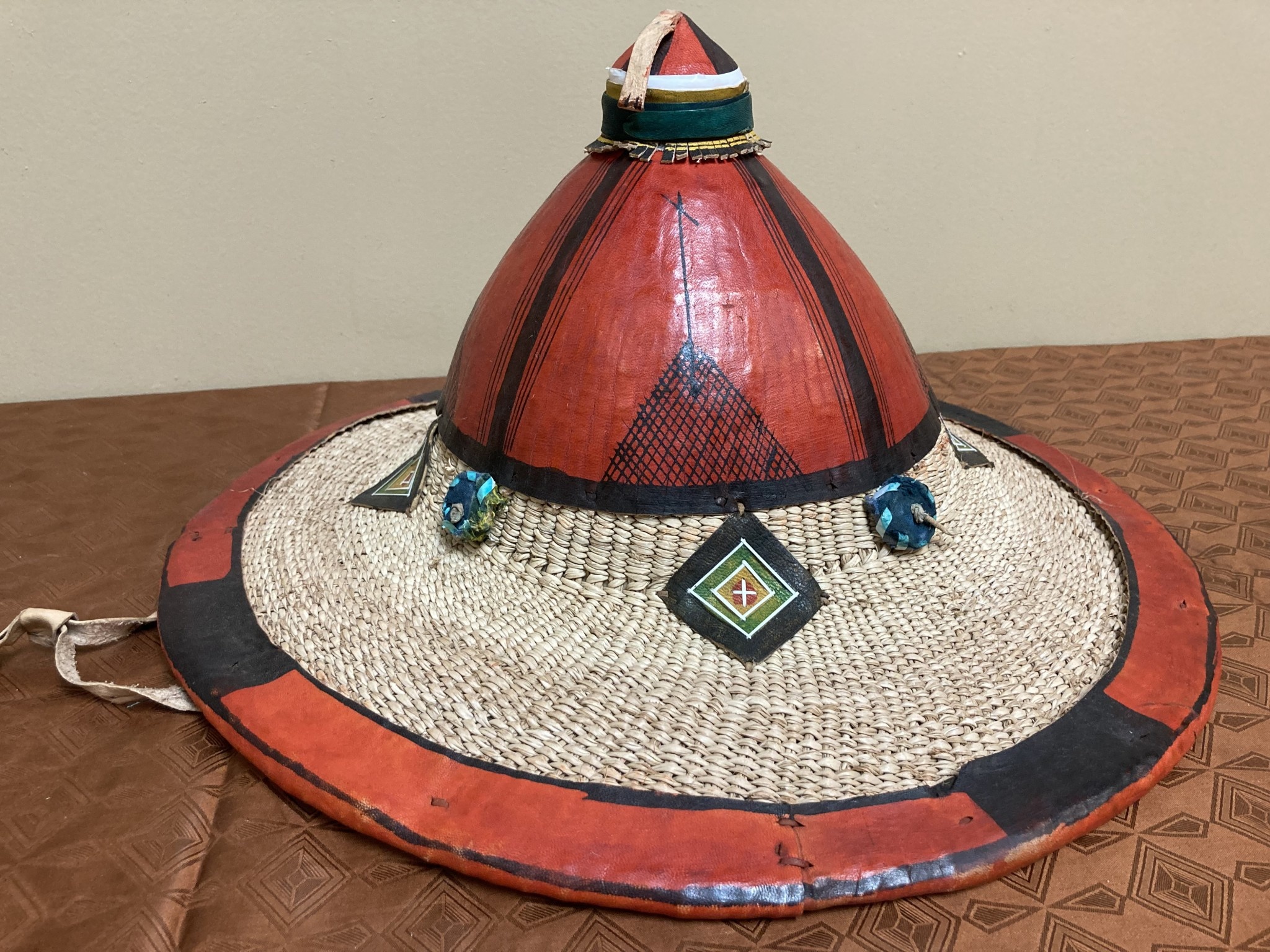 Fulani hat: The Fulani live in about 5-6 african nations (Guinea, Mali, Niger, Senegal, and Nigeria). This is a grand example of their hats, it is larger and fancier than their average hat. 16" diamet