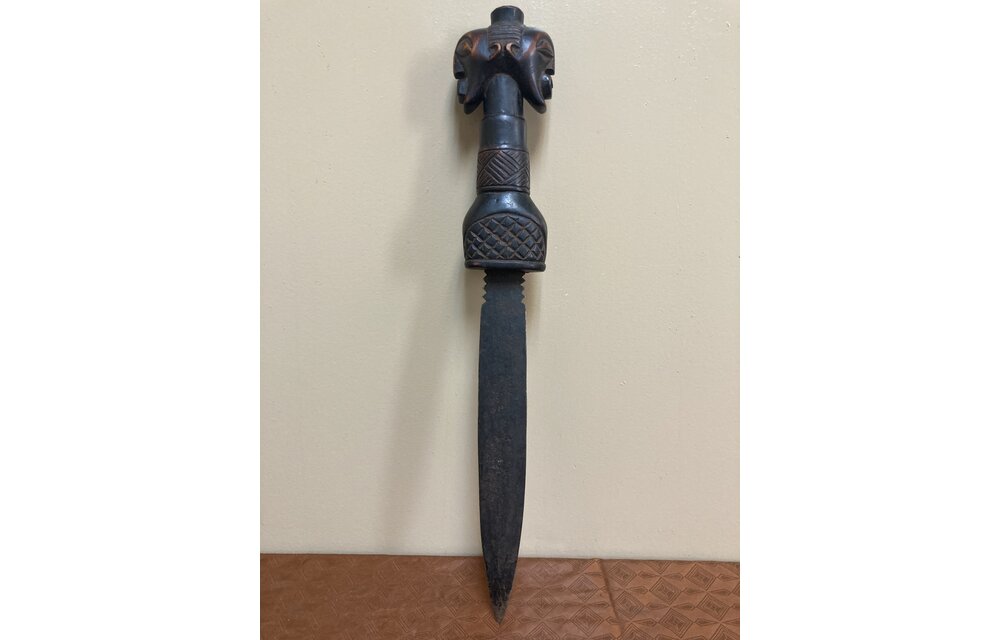 Songye dagger of Democratic Republic of Congo is iron with a wooden, carved handle. 19 ¾” long