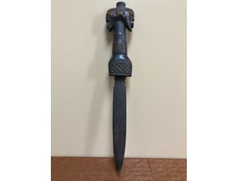 Songye dagger of Democratic Republic of Congo is iron with a wooden, carved handle. 19 ¾” long