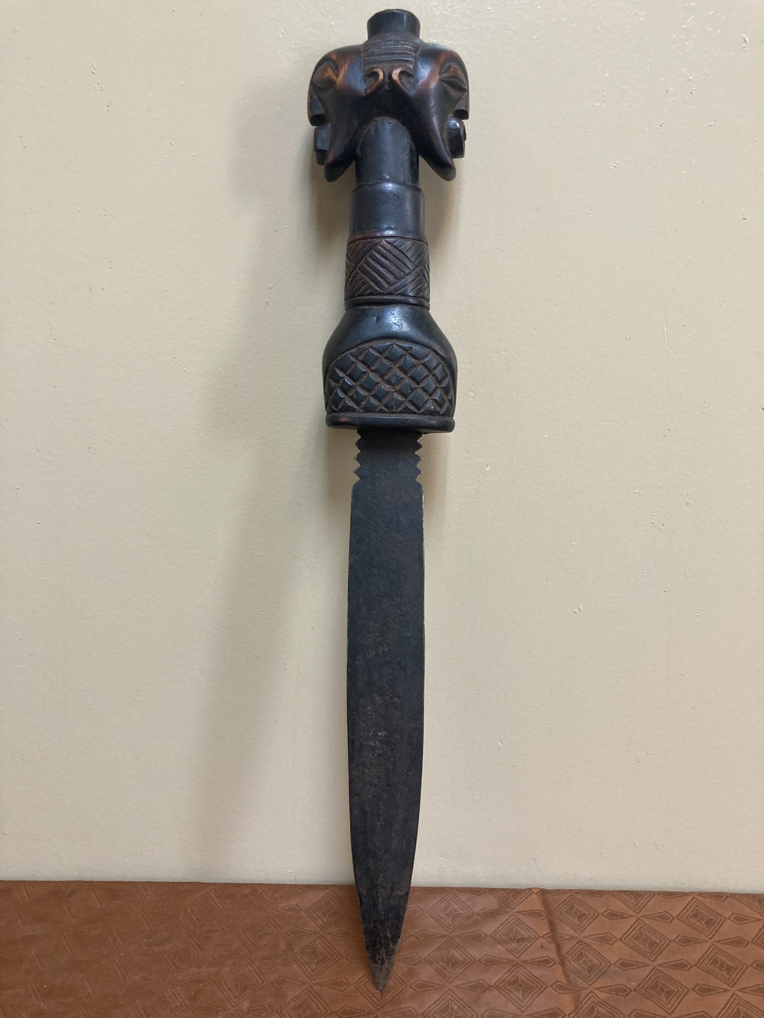 Songye dagger of Democratic Republic of Congo is iron with a wooden, carved handle. 19 ¾” long